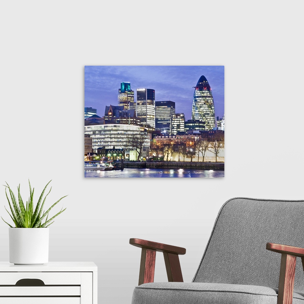 A modern room featuring St Mary Axe, also known as the Gherkin, the Cucumber Building and the Swiss Re Building, is a sky...