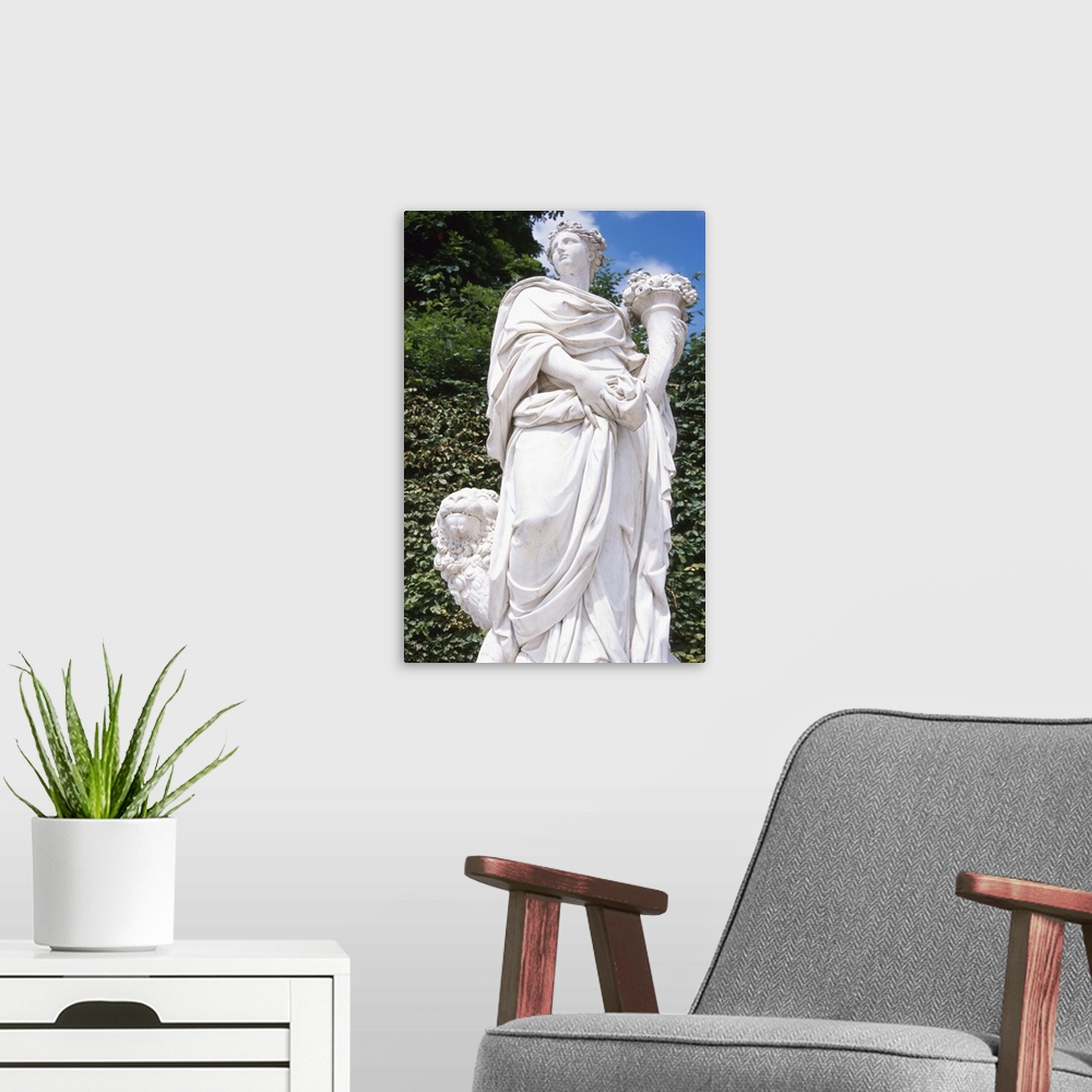 A modern room featuring Statue in the garden of a woman holding a cornuccpoia