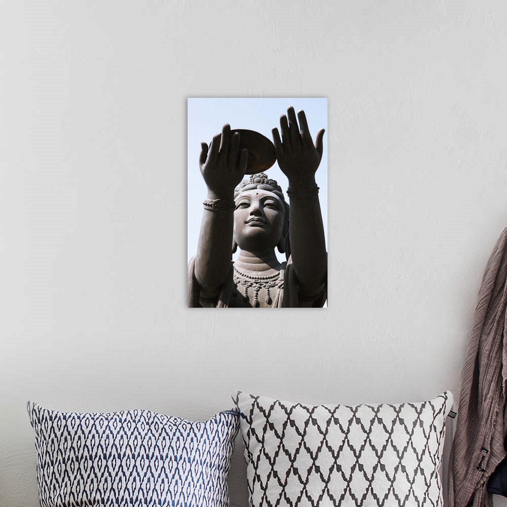 A bohemian room featuring Statue of Buddha against blue sky