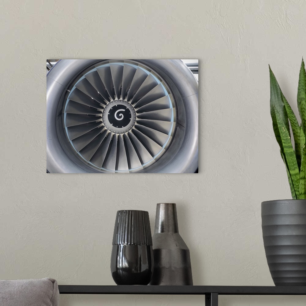 A modern room featuring Close up of still jet airplane engine