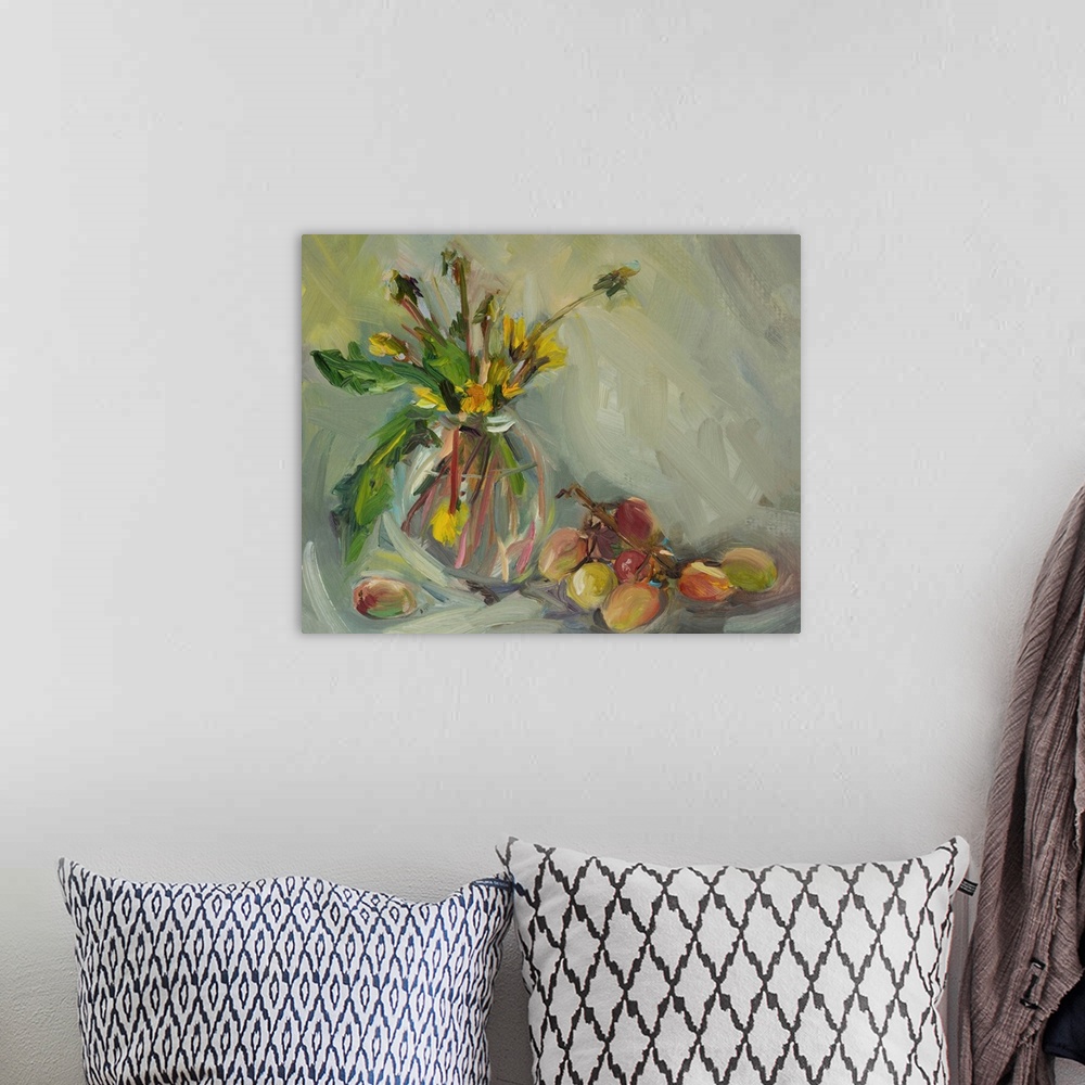 A bohemian room featuring Still life with grapes and a bouquet of yellow dandelions in a vase.