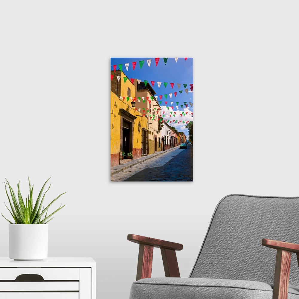 A modern room featuring Street In San Miguel De Allende Decorated With Colorful Flags