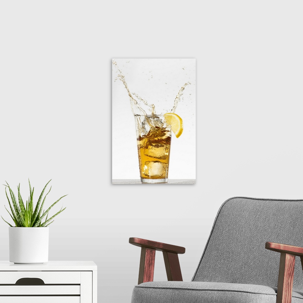 A modern room featuring Studio shot of iced tea with splash