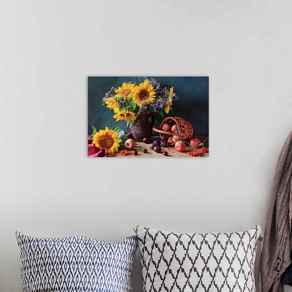 A bohemian room featuring Big photograph composed of a flower arrangement sitting within and around a ceramic jug that is n...