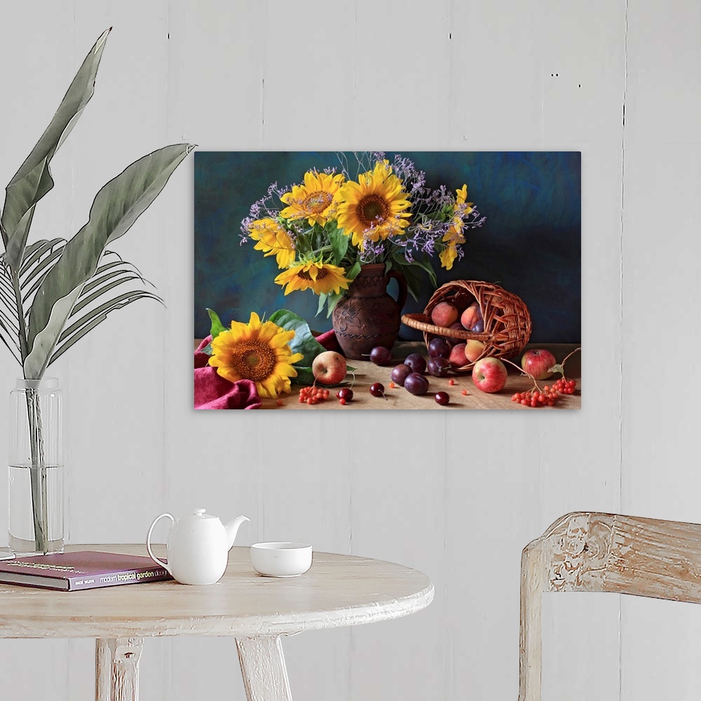 A farmhouse room featuring Big photograph composed of a flower arrangement sitting within and around a ceramic jug that is n...