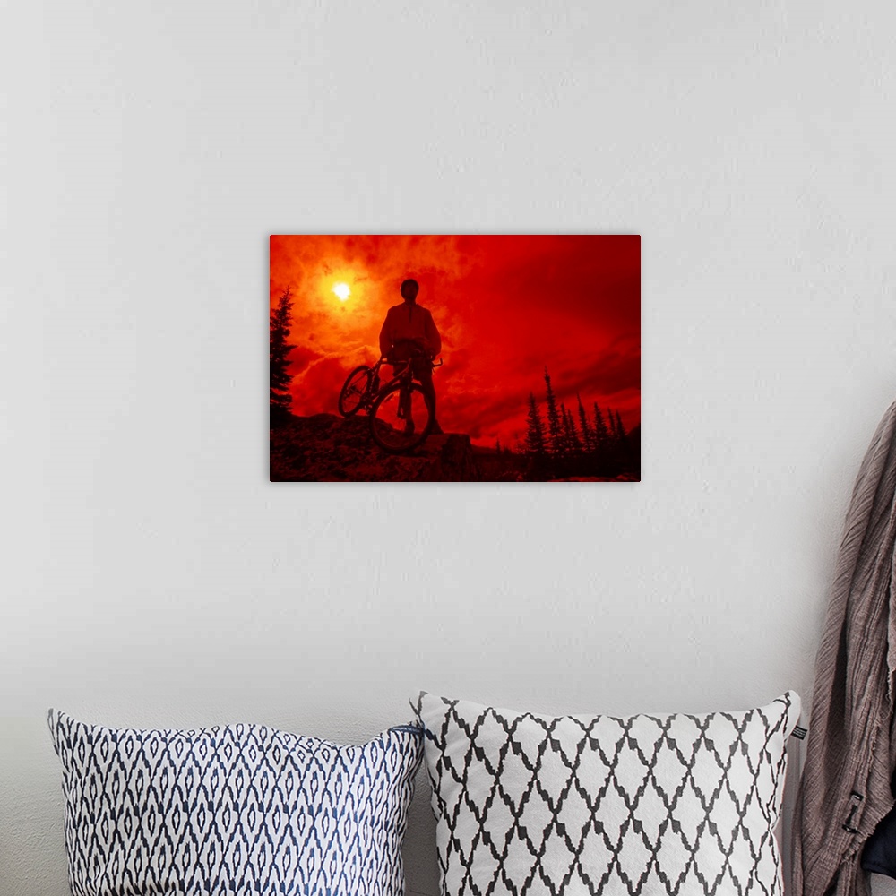 A bohemian room featuring Sun behind cyclist on hill