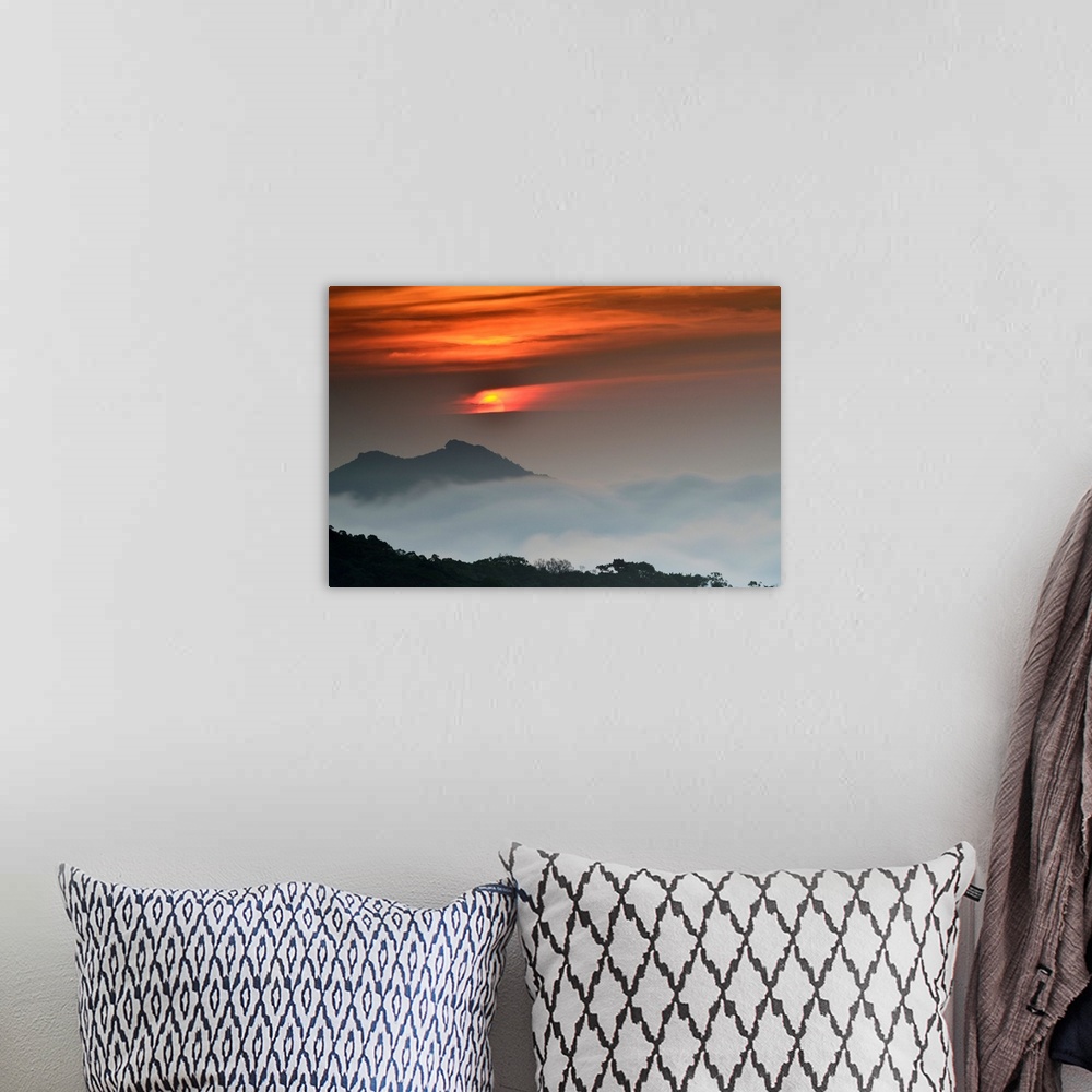 A bohemian room featuring Sunrise against beautiful landscape and fog.