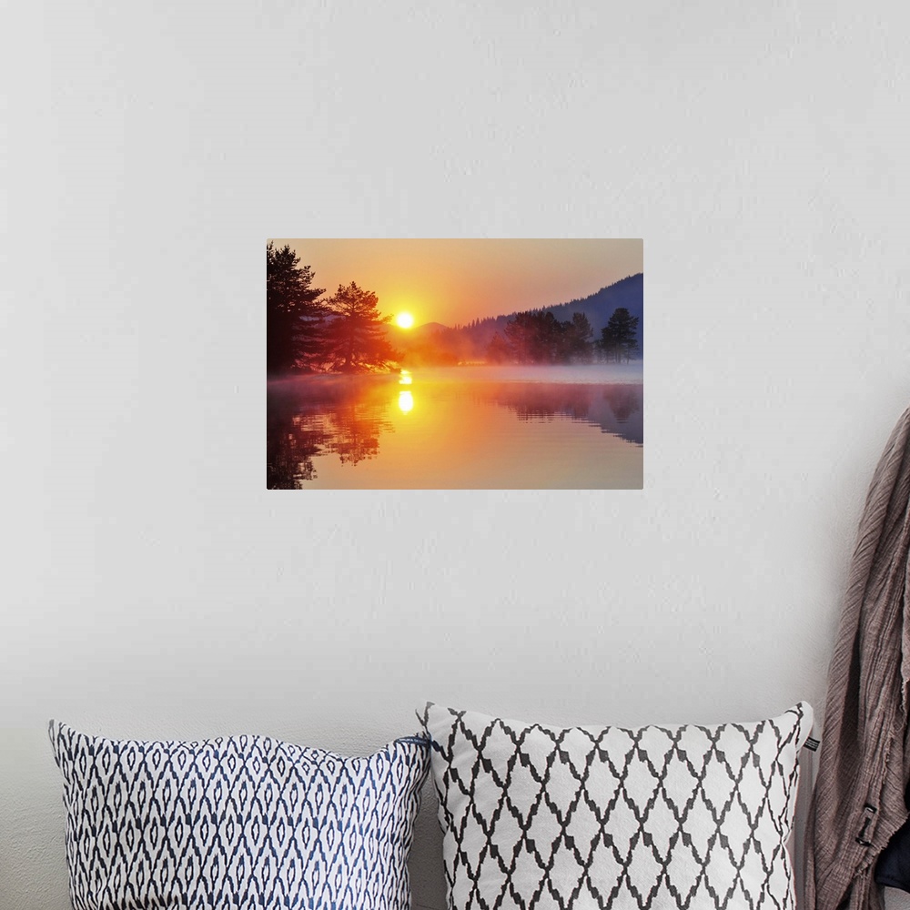 A bohemian room featuring Sunrise at mountain lake with island of pine trees.
