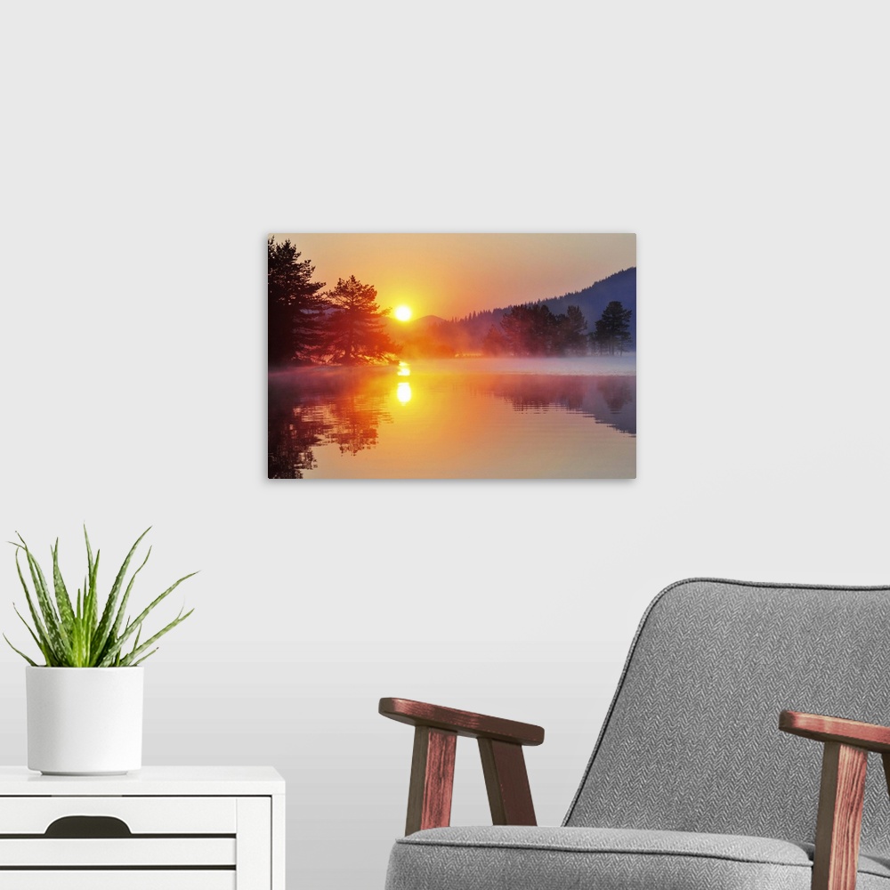 A modern room featuring Sunrise at mountain lake with island of pine trees.