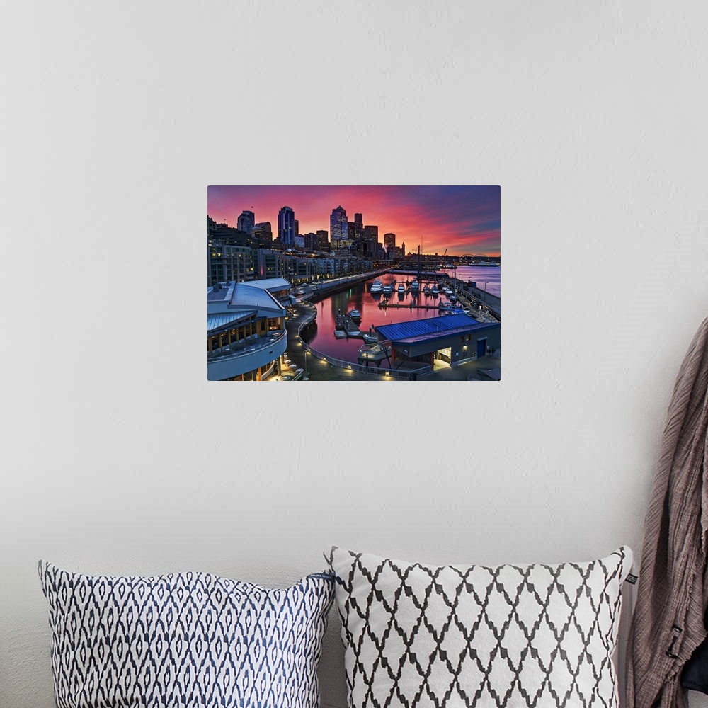 A bohemian room featuring Big canvas photo art of downtown Seattle meeting a harbor with a vibrant sunset in the distance.