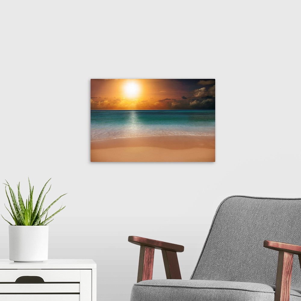 A modern room featuring Sunrise over a beach