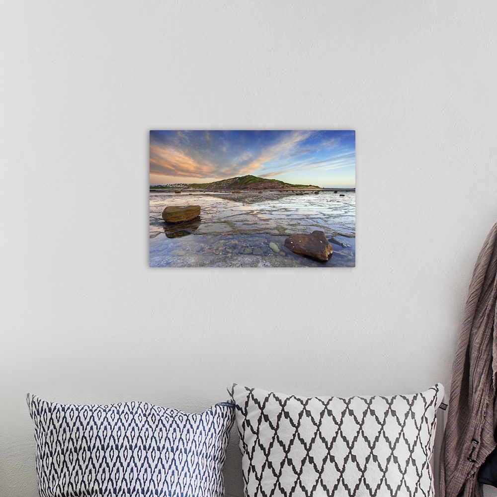 A bohemian room featuring Sunrise over headland at Longreef on Sydney's Northern beaches.