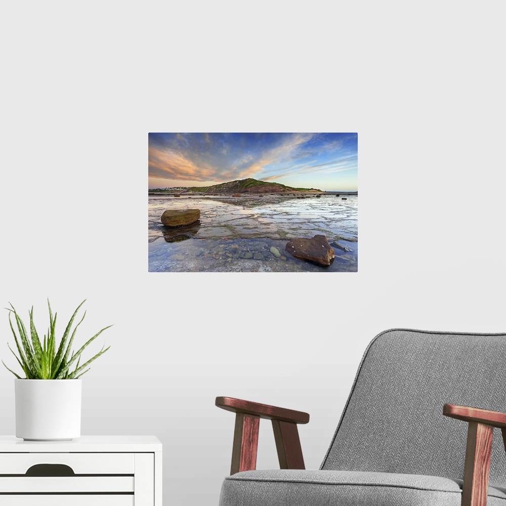 A modern room featuring Sunrise over headland at Longreef on Sydney's Northern beaches.