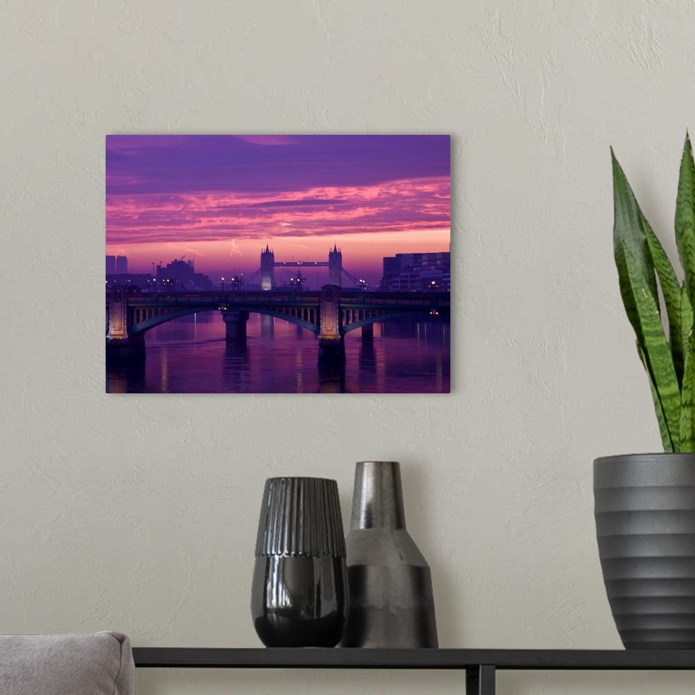 A modern room featuring Sunrise over the Thames and Tower Bridge in London.