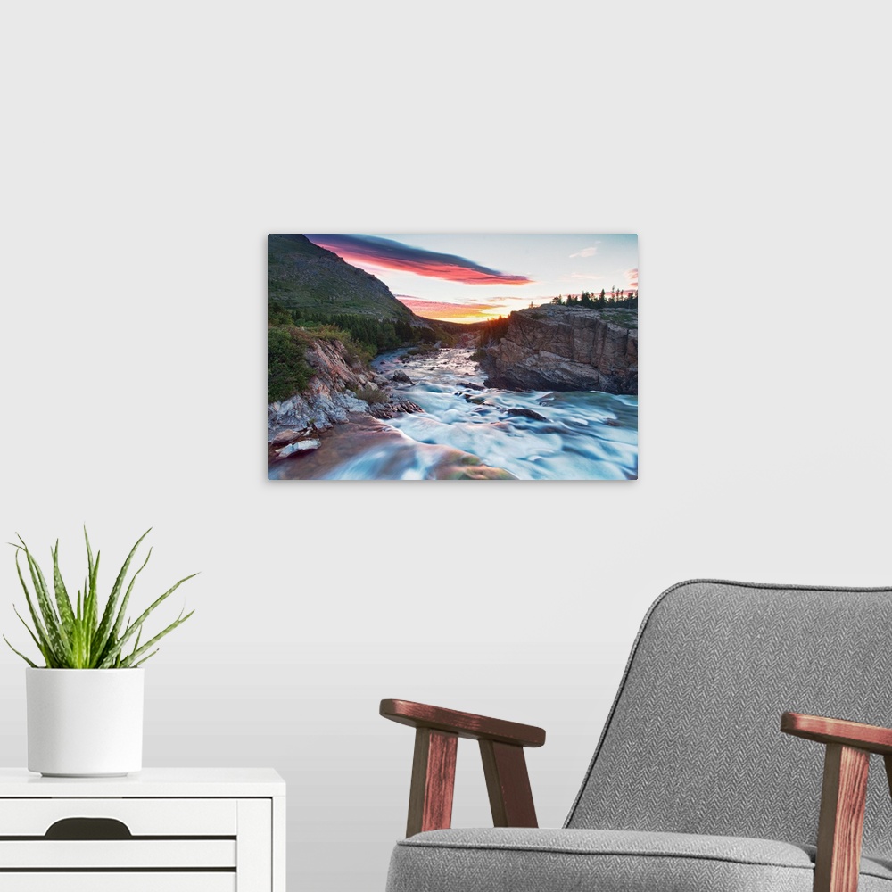 A modern room featuring Sunrise overlooking Swiftcurrent Creek at Many Glacier area of Glacier National Park.