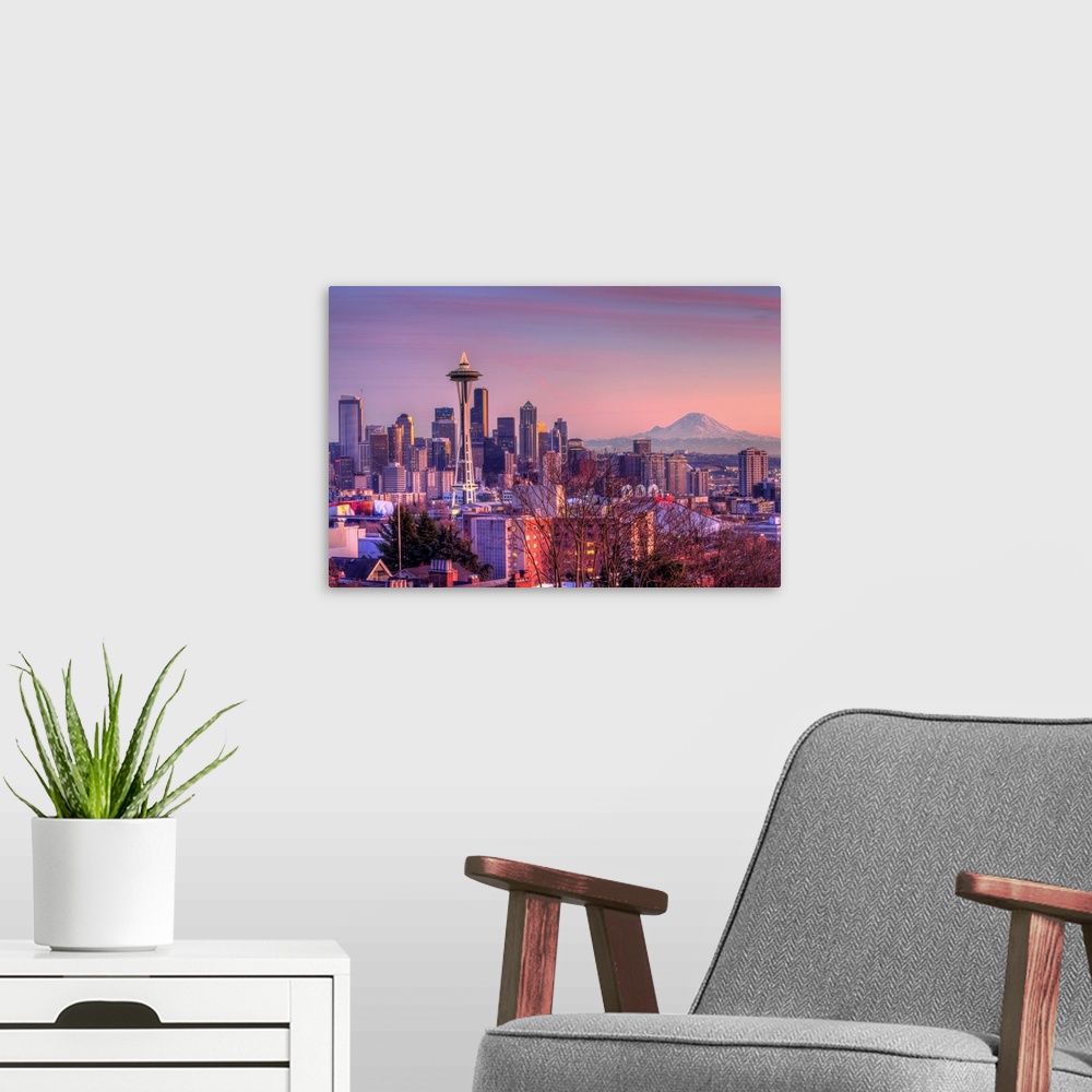 A modern room featuring Large photo on canvas of downtown Seattle bathed in warm light from a setting sun.