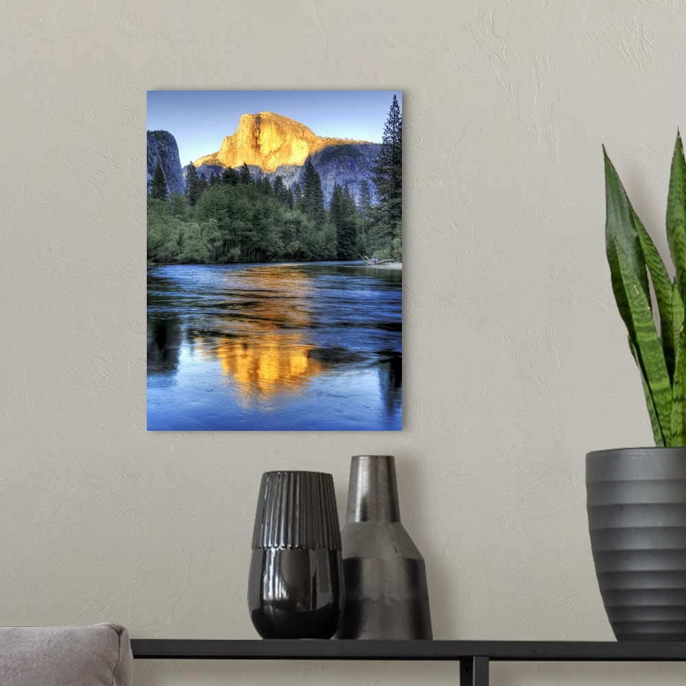 A modern room featuring Golden light of sunset on half Dome reflecting in Merced river in Yosemite National Park.