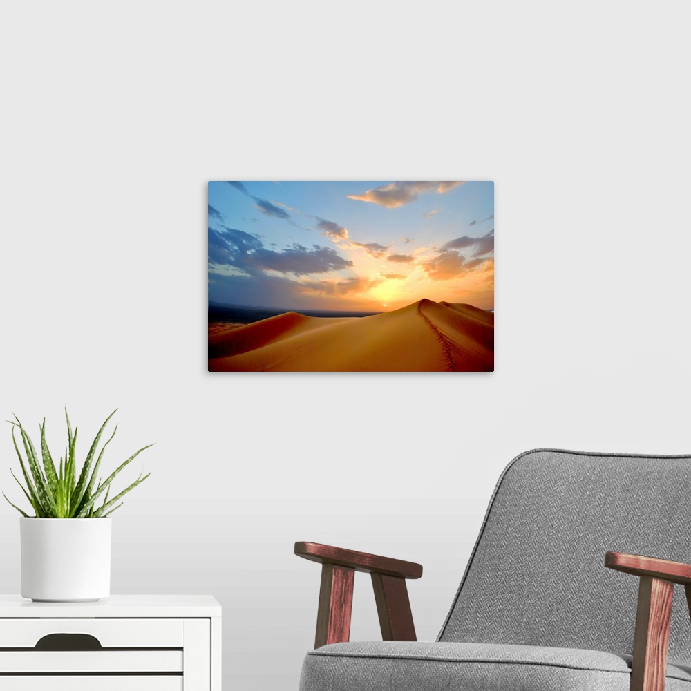 A modern room featuring Sunset on top of dune.