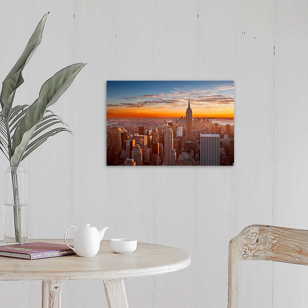 A farmhouse room featuring Landscape orientation photograph of skyscrapers at the end of the day.