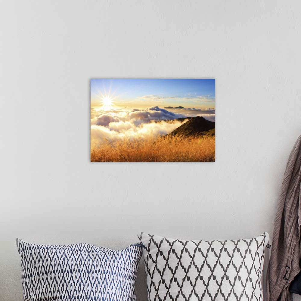 A bohemian room featuring Sunset over mountains with sea of clouds below.