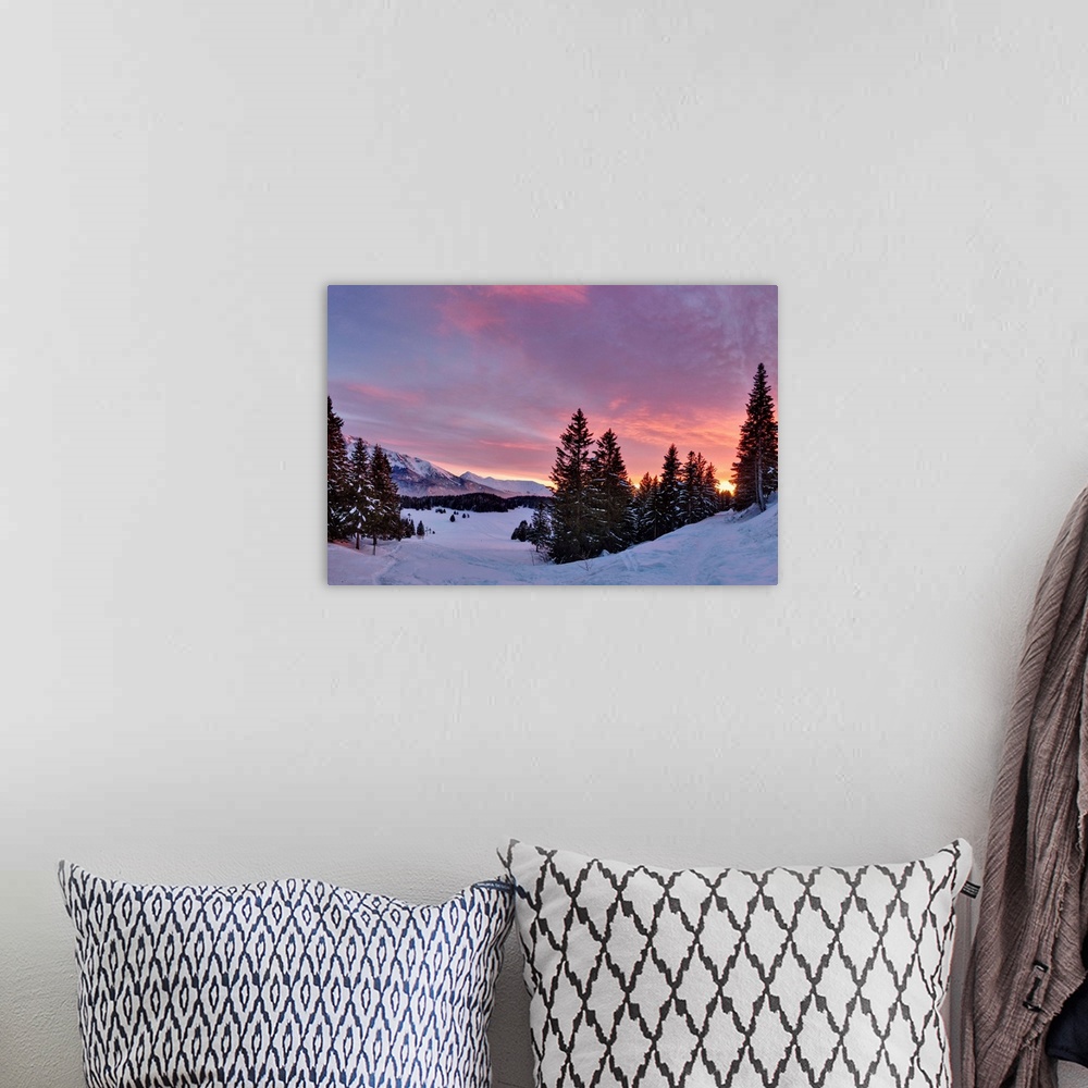 A bohemian room featuring Sunset over snowy forest in French Alps near Grenoble.