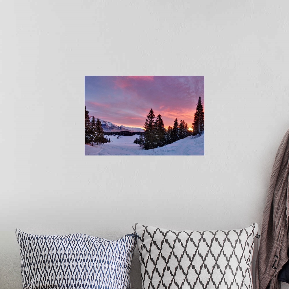 A bohemian room featuring Sunset over snowy forest in French Alps near Grenoble.