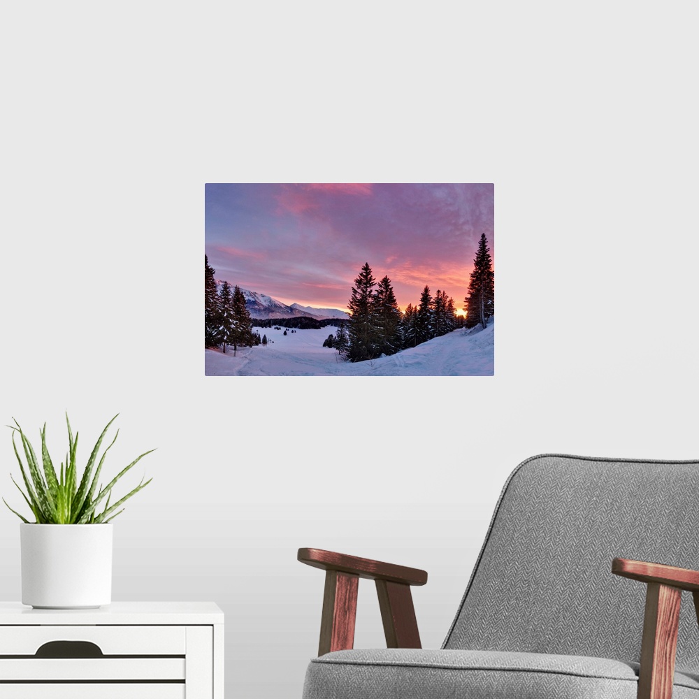 A modern room featuring Sunset over snowy forest in French Alps near Grenoble.