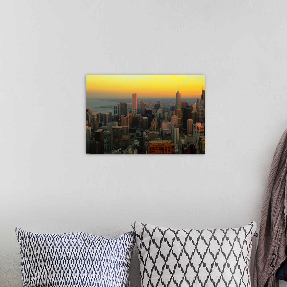 A bohemian room featuring Large wall docor of the downtown Chicago skyline at sunset.