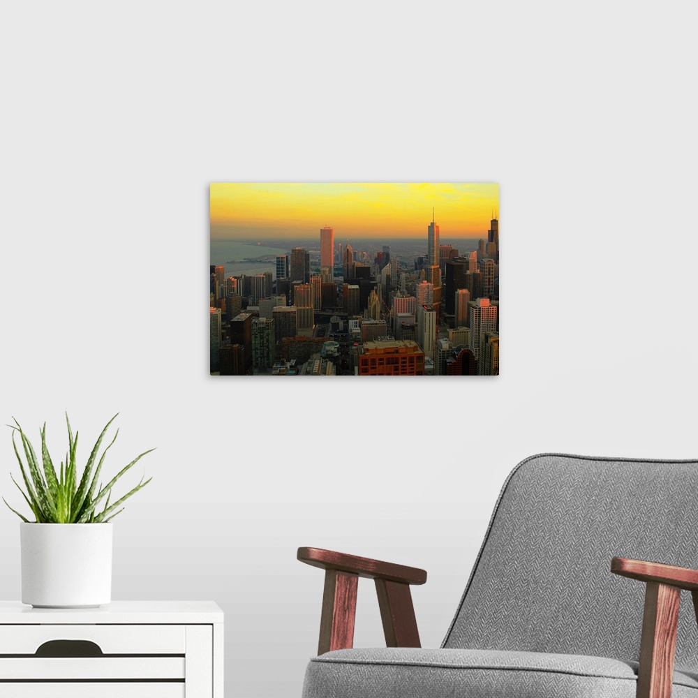A modern room featuring Large wall docor of the downtown Chicago skyline at sunset.