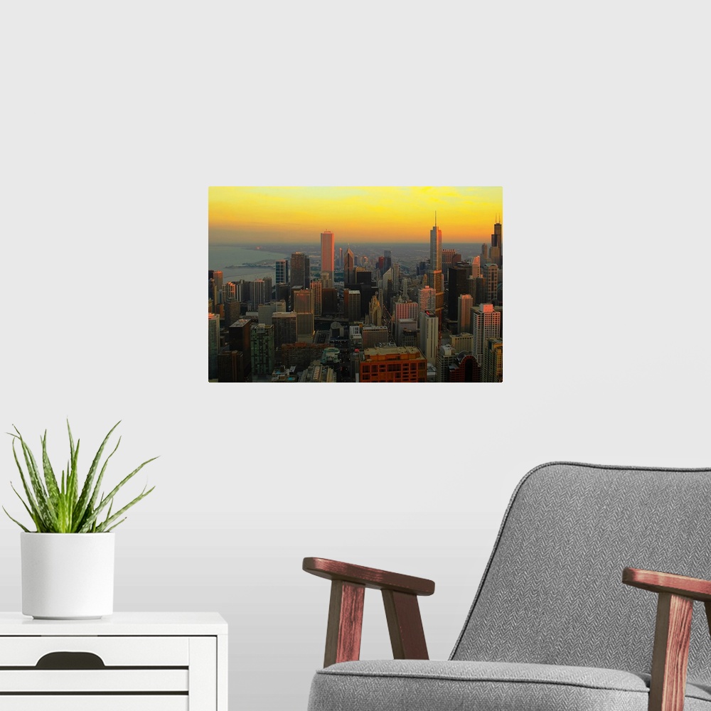 A modern room featuring Large wall docor of the downtown Chicago skyline at sunset.