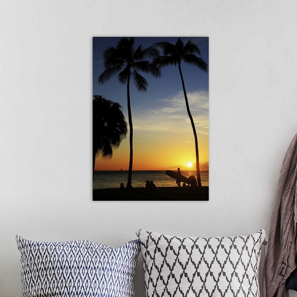 A bohemian room featuring Silhouette surfboards and palm trees at Waikiki Beach, Hawaii.