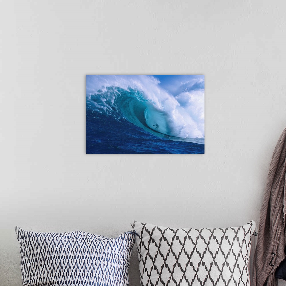 A bohemian room featuring Professional surfer Garrett McNamara shooting the curl of Jaws, an incredibly huge and powerful w...