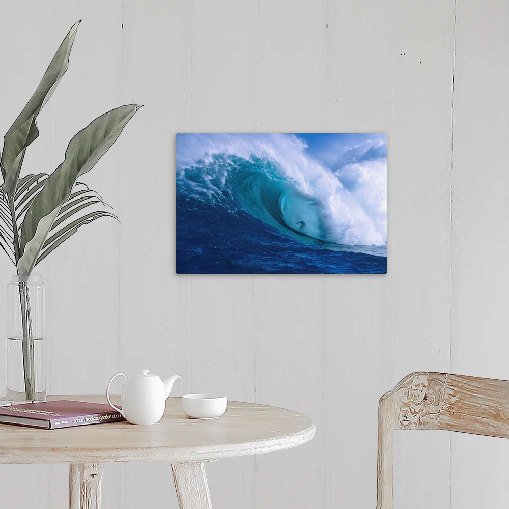 A farmhouse room featuring Professional surfer Garrett McNamara shooting the curl of Jaws, an incredibly huge and powerful w...