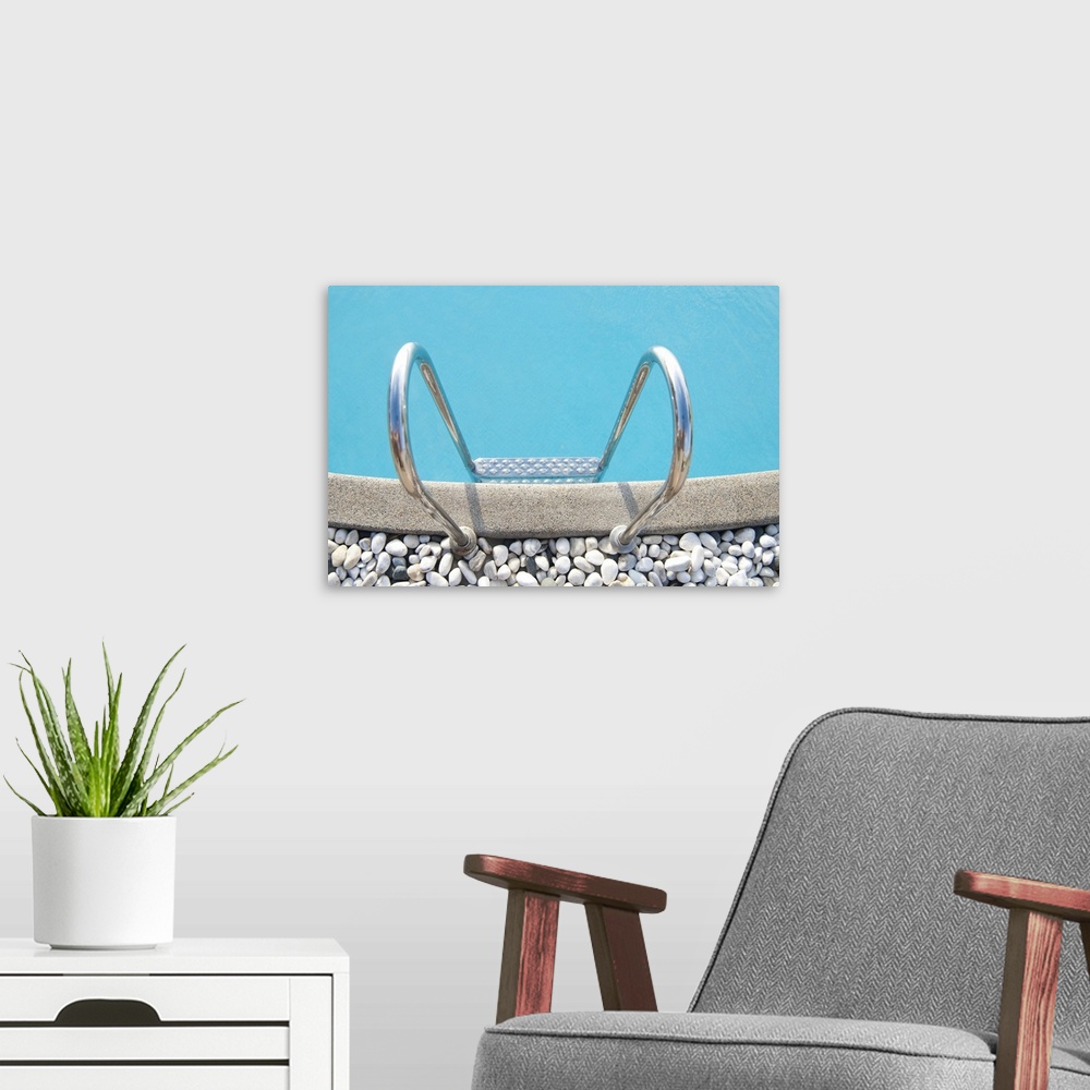 A modern room featuring Swimming pool with white pebbles in edge.