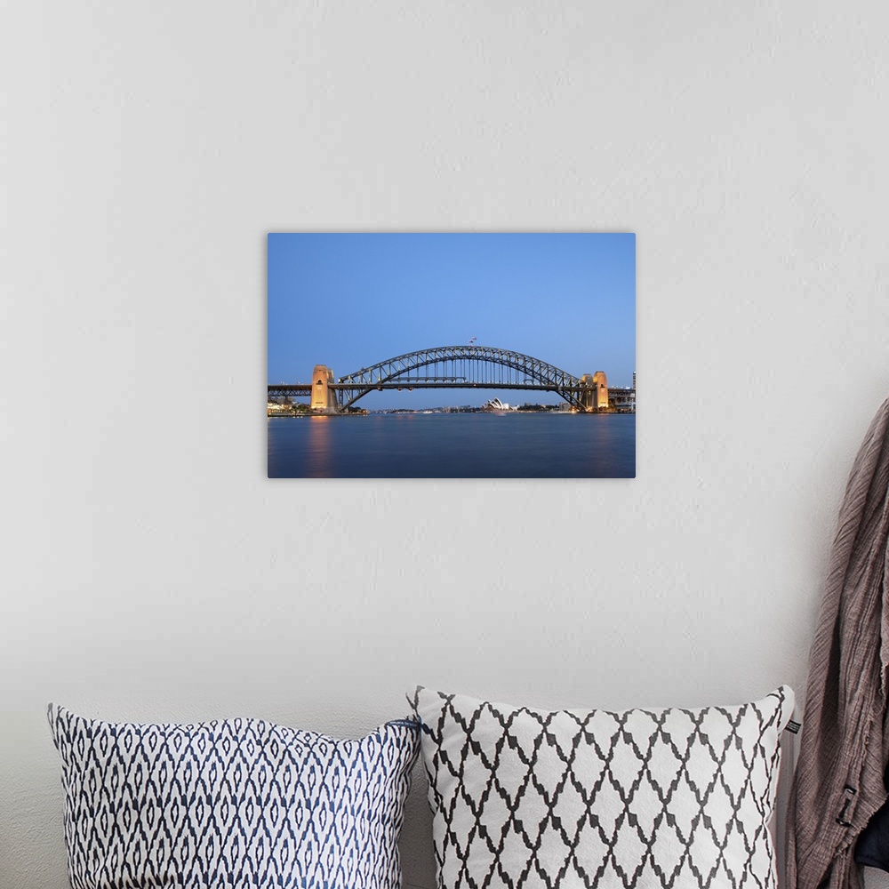 A bohemian room featuring Sydney Harbour Bridge and Opera House at dusk