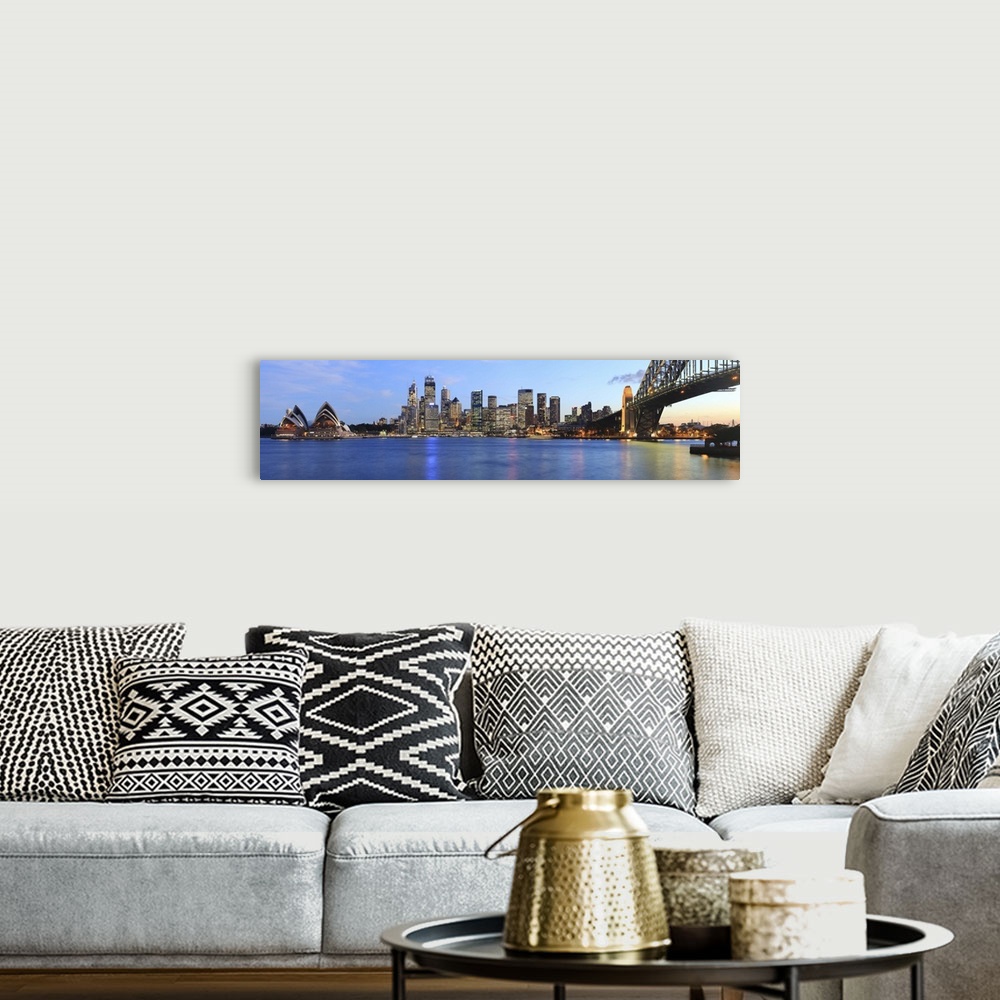A bohemian room featuring Panorama of Sydney Harbour Bridge at dusk with CBD skyline and the Opera House.