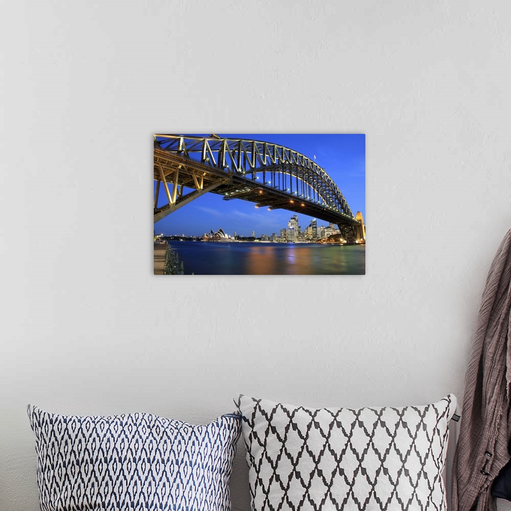 A bohemian room featuring Sydney Harbour Bridge, Sydney Opera House and city skyline at dusk