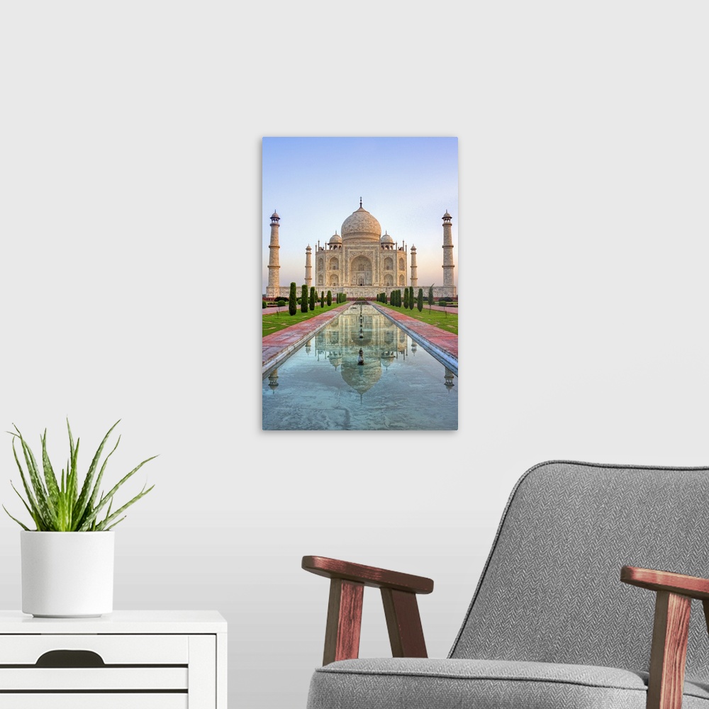 A modern room featuring Taj Mahal in Agra, India shot at sunrise with no people in frame.