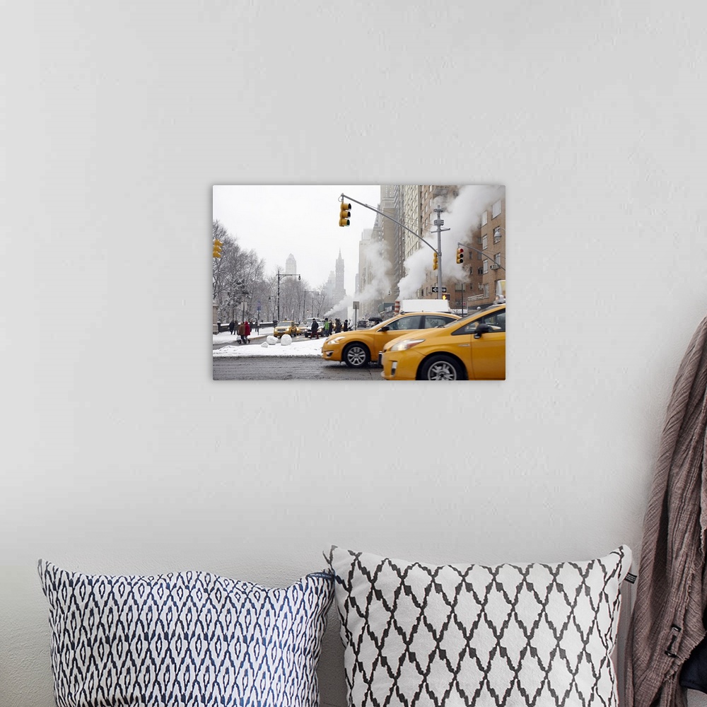 A bohemian room featuring Taxi cabs on New York City street during winter
