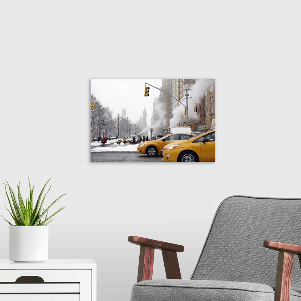 A modern room featuring Taxi cabs on New York City street during winter