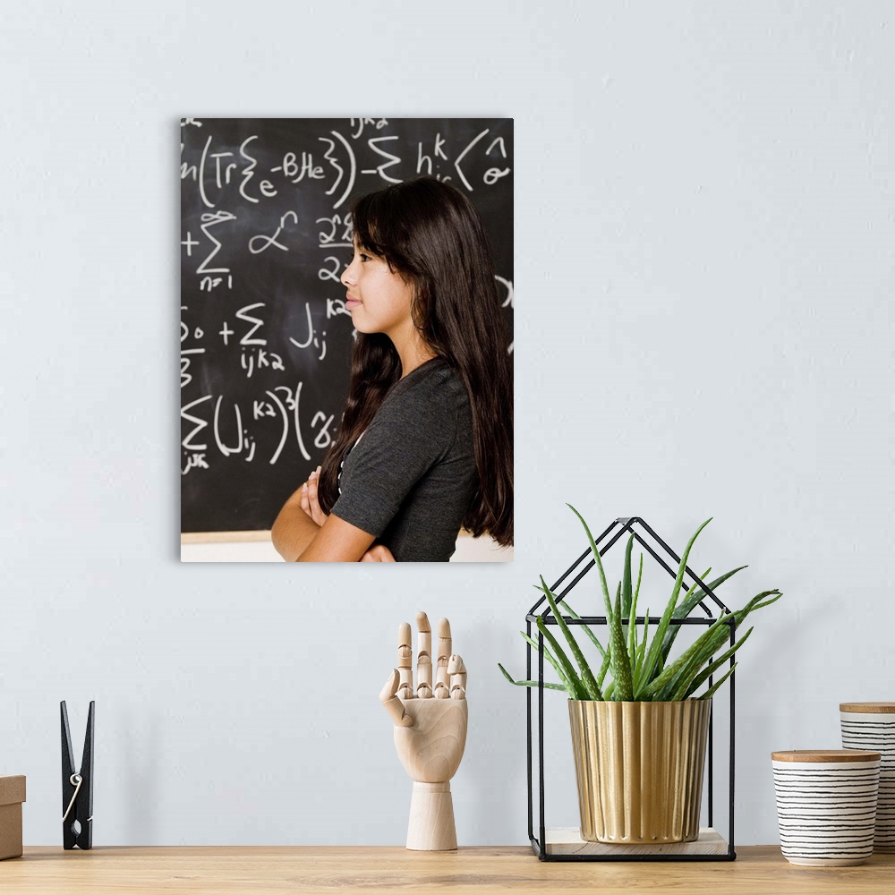 A bohemian room featuring Teenage girl student at blackboard with math equations