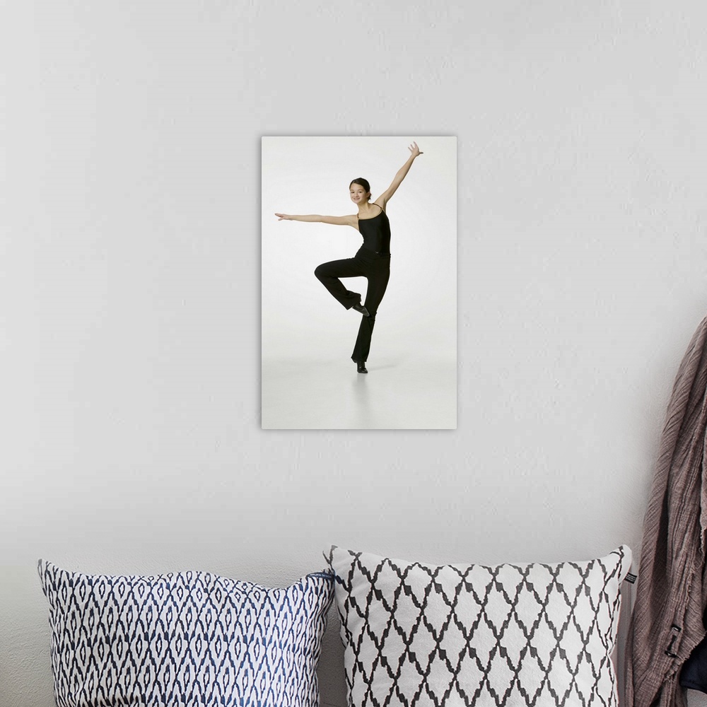 A bohemian room featuring Teenage girl (14-15) performing gymnastic in studio, portrait