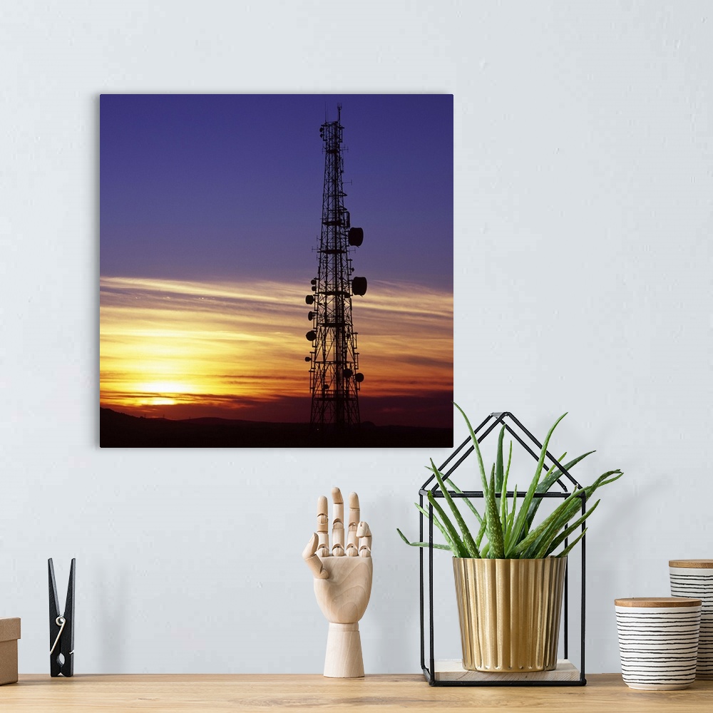A bohemian room featuring Telecommunications mast at sunset