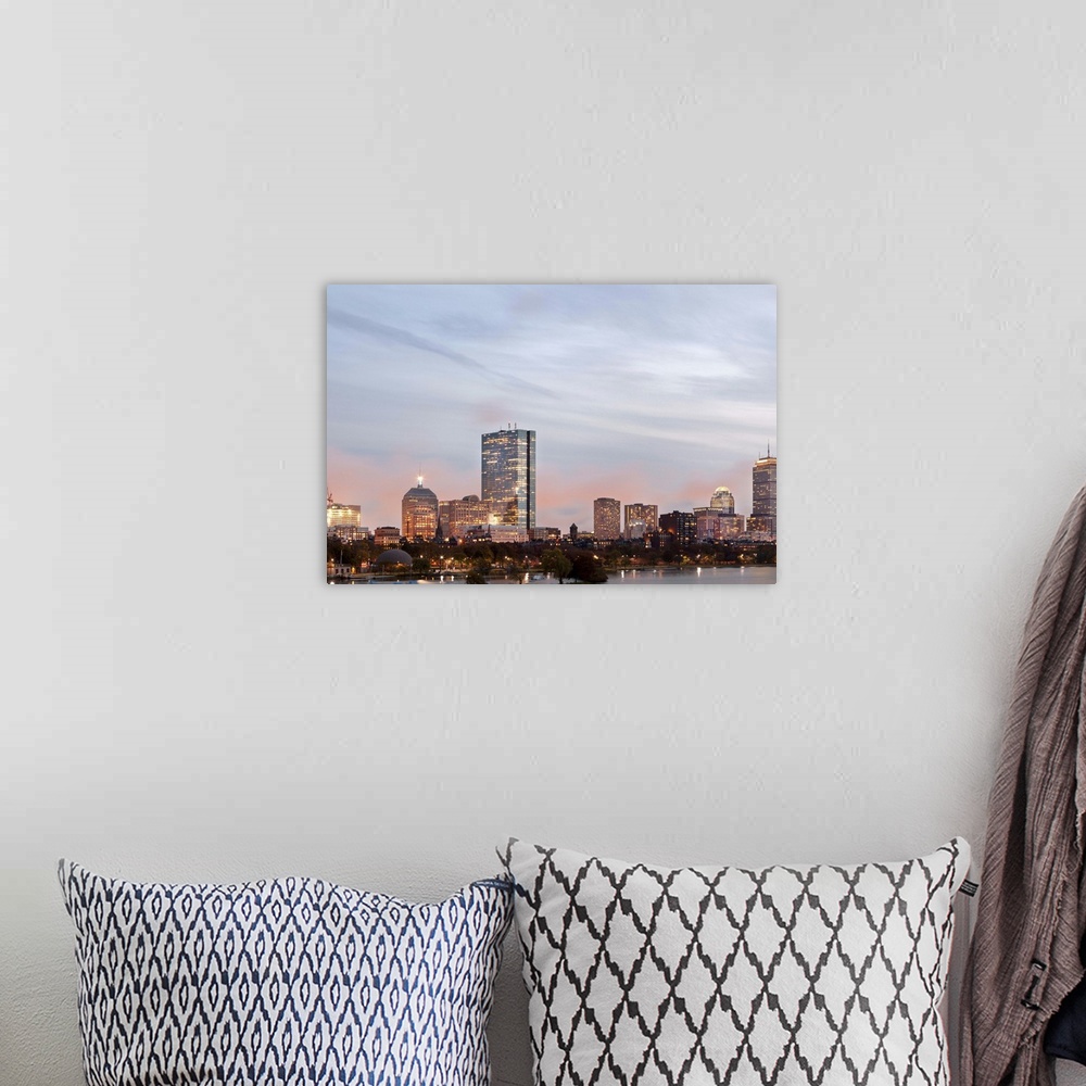 A bohemian room featuring The city of Boston from Charles River at dusk