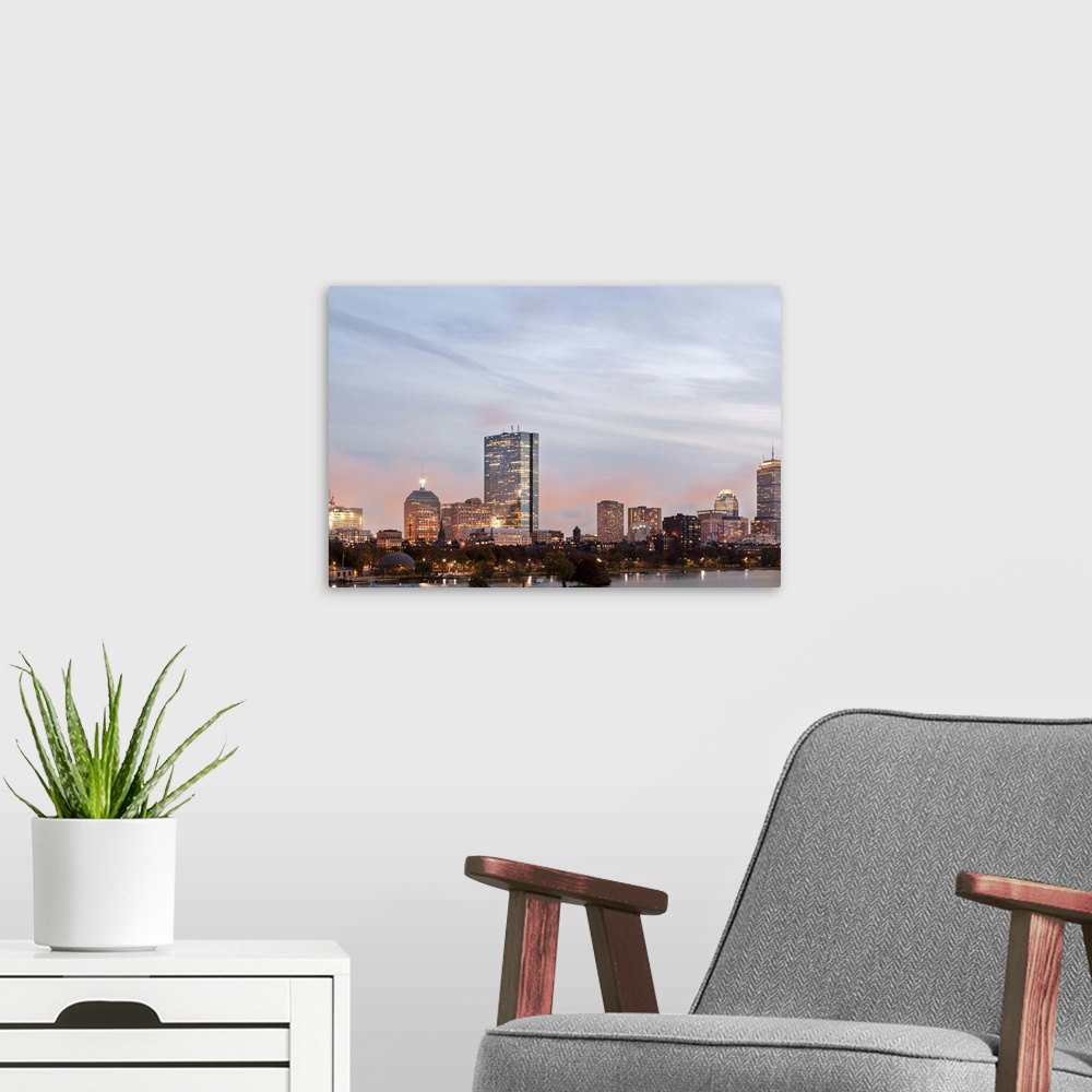 A modern room featuring The city of Boston from Charles River at dusk