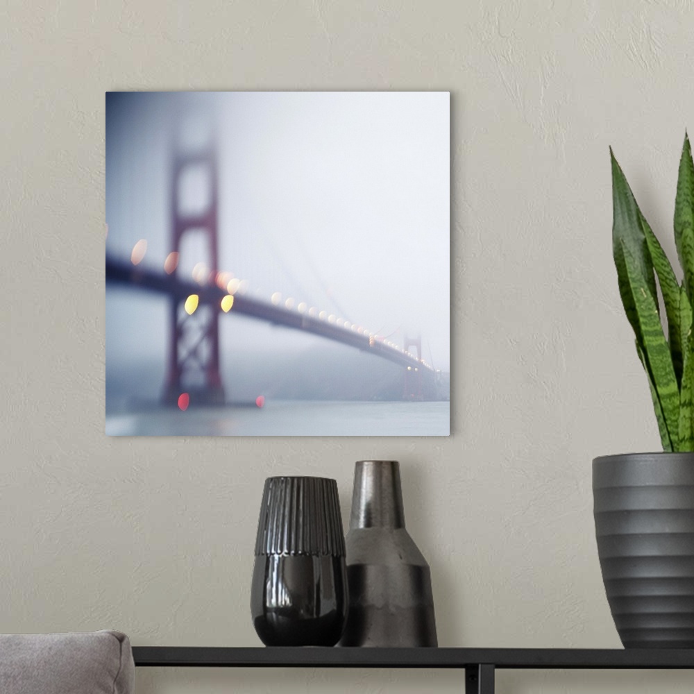 A modern room featuring The Golden Gate Bridge in San Francisco one slightly foggy morning.