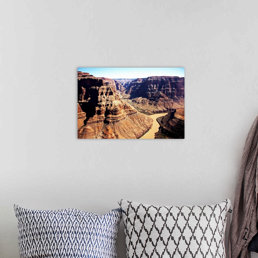 A bohemian room featuring The Grand Canyon and the red Colorado River