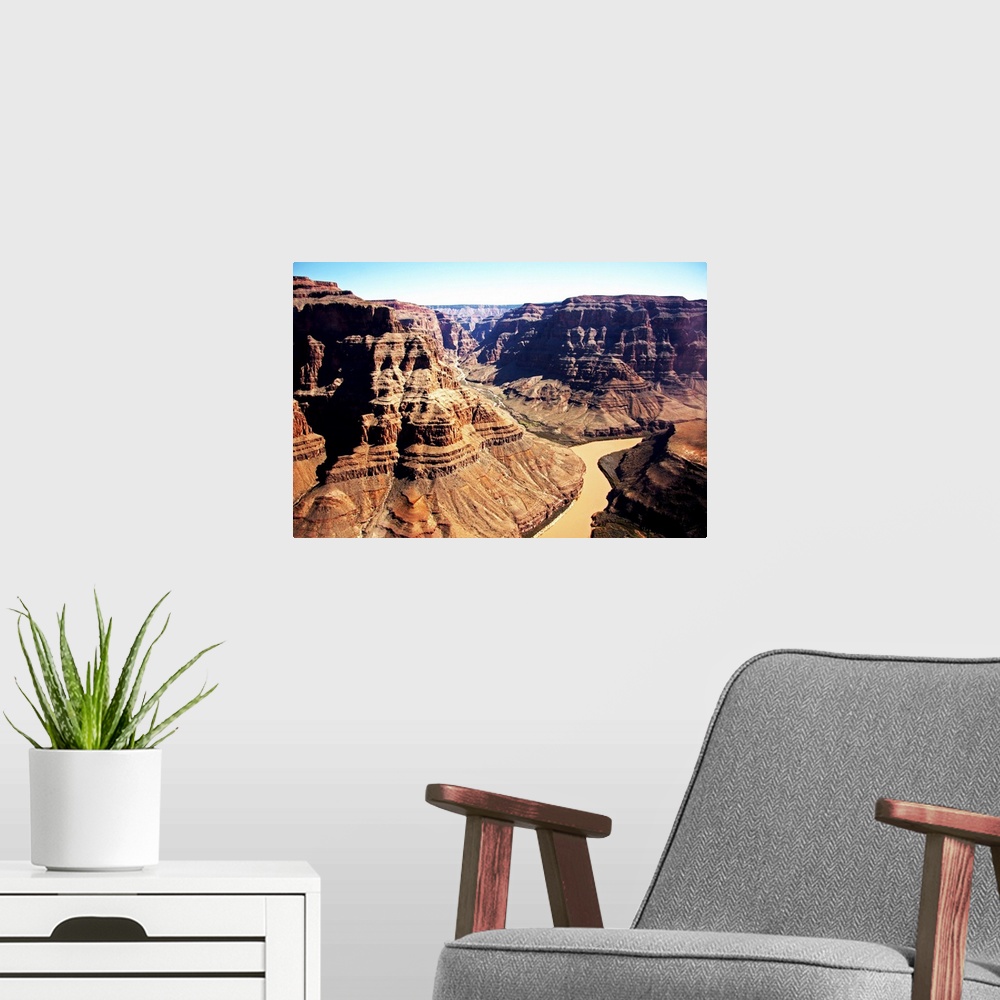 A modern room featuring The Grand Canyon and the red Colorado River