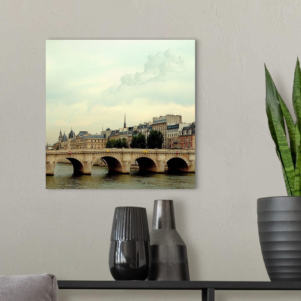 A modern room featuring The many bridges crossing the Seine River in Paris France.