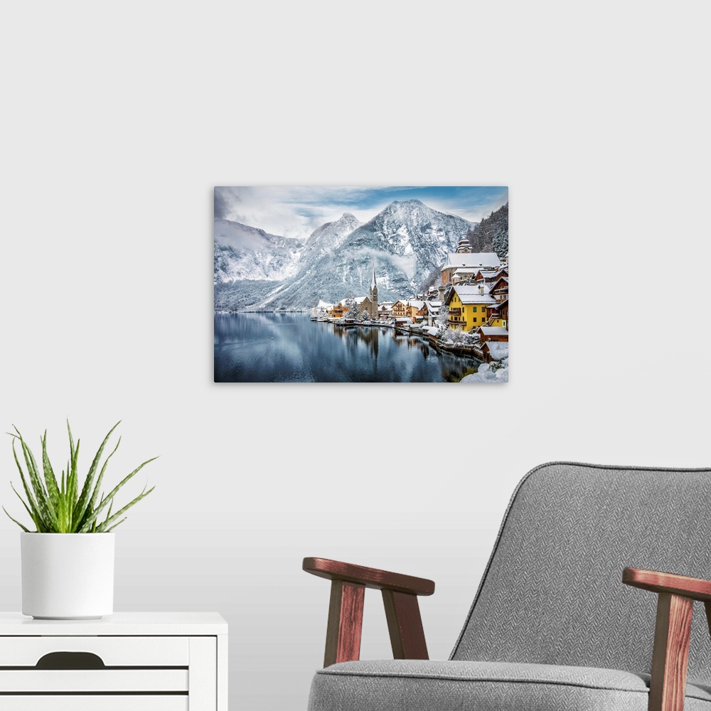 A modern room featuring The snow covered village of Hallstatt in the Austrian Alps during winter time